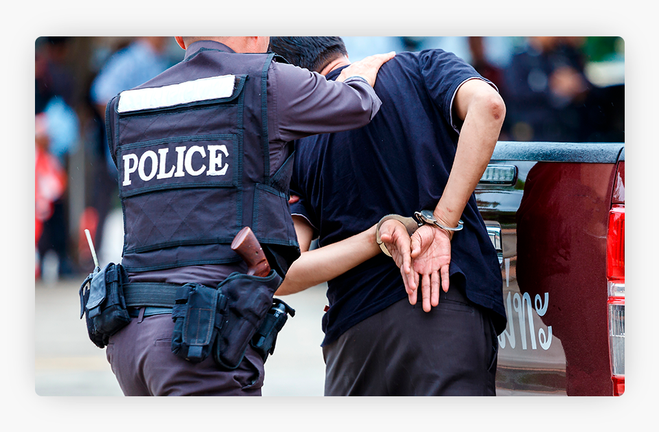 Police Officer Arresting a Man