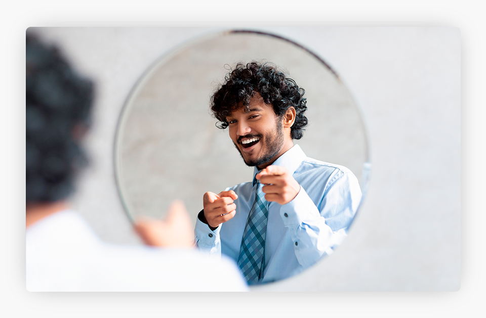 Happy Man Pointing at Himself in the Mirror