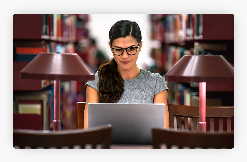 Woman on Laptop on Library