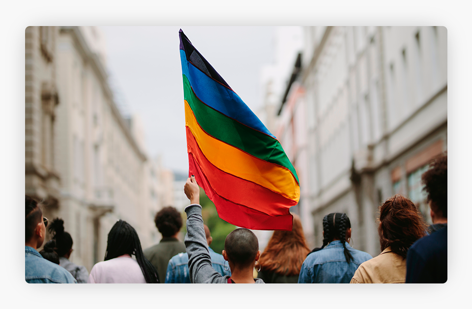 Person Holding a LGBTQ Flag