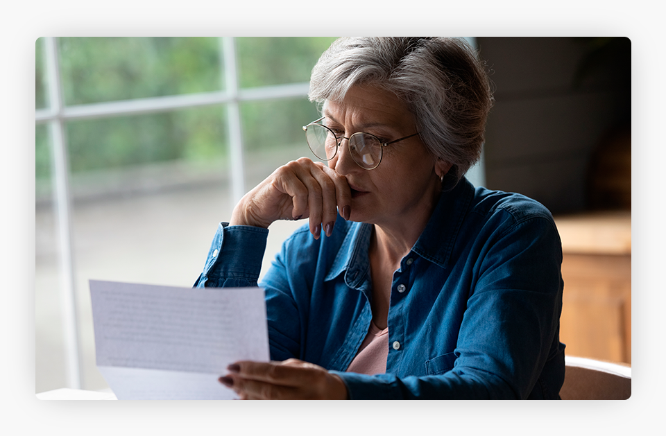 Worried Woman Reading a Letter