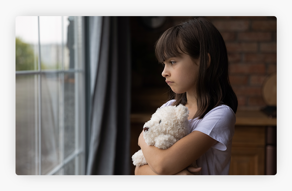 A Girl Looking Through a Window