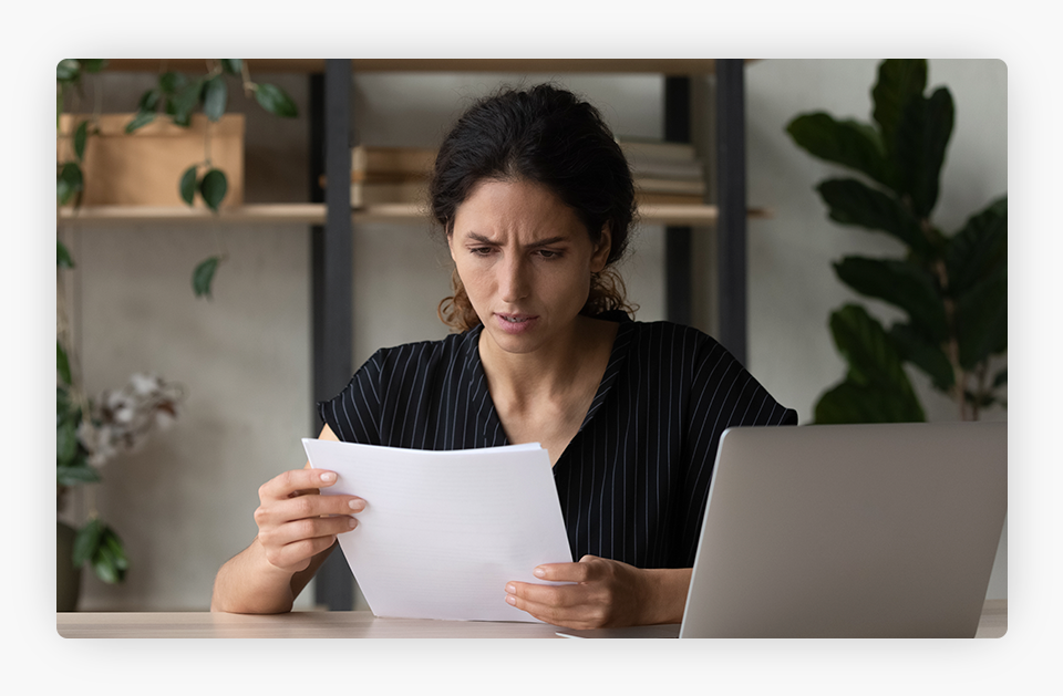 Person Concerned Looking at a Paper