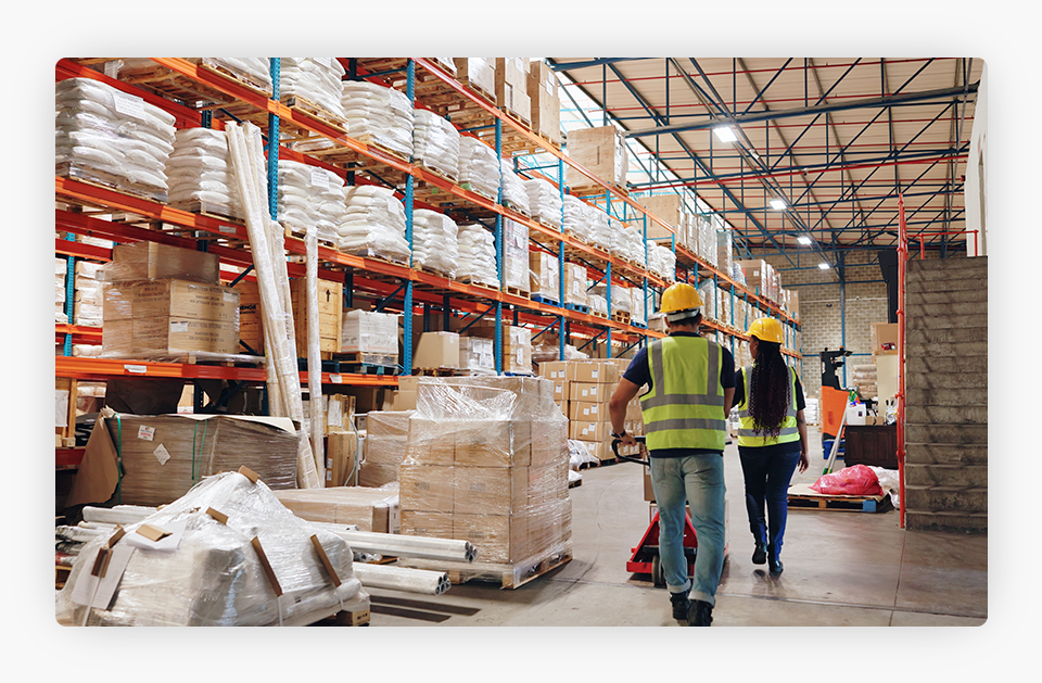 Workers Next to Boxes on a Shipping Company