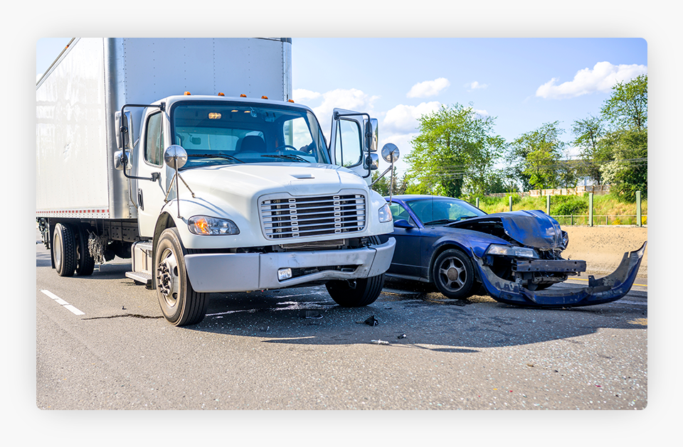 Truck With a Car Crashed Next to It