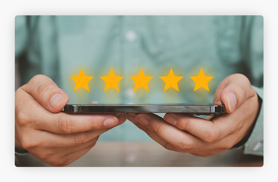 Man holding a cellphone with five yellow stars, symbolizing a positive client review.